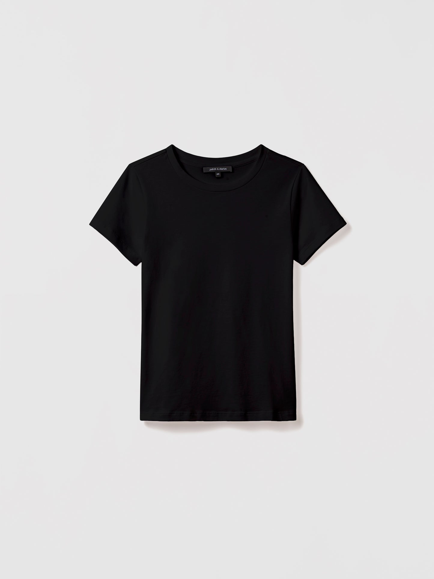 Black t-shirt on a light gray background