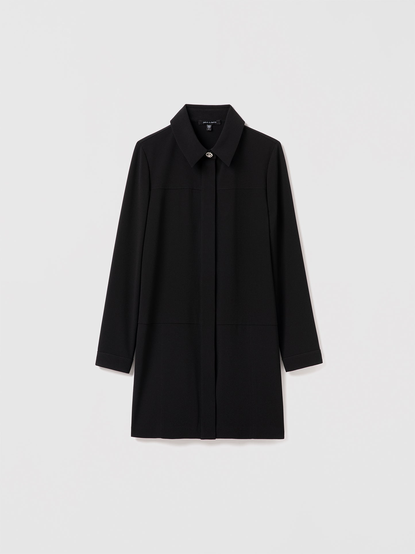 Black Edina B mini dress by Judith and Charles, long sleeve straight style in satin back crepe with shirt collar and jewel buttons. Made in Canada with Japanese fabric.