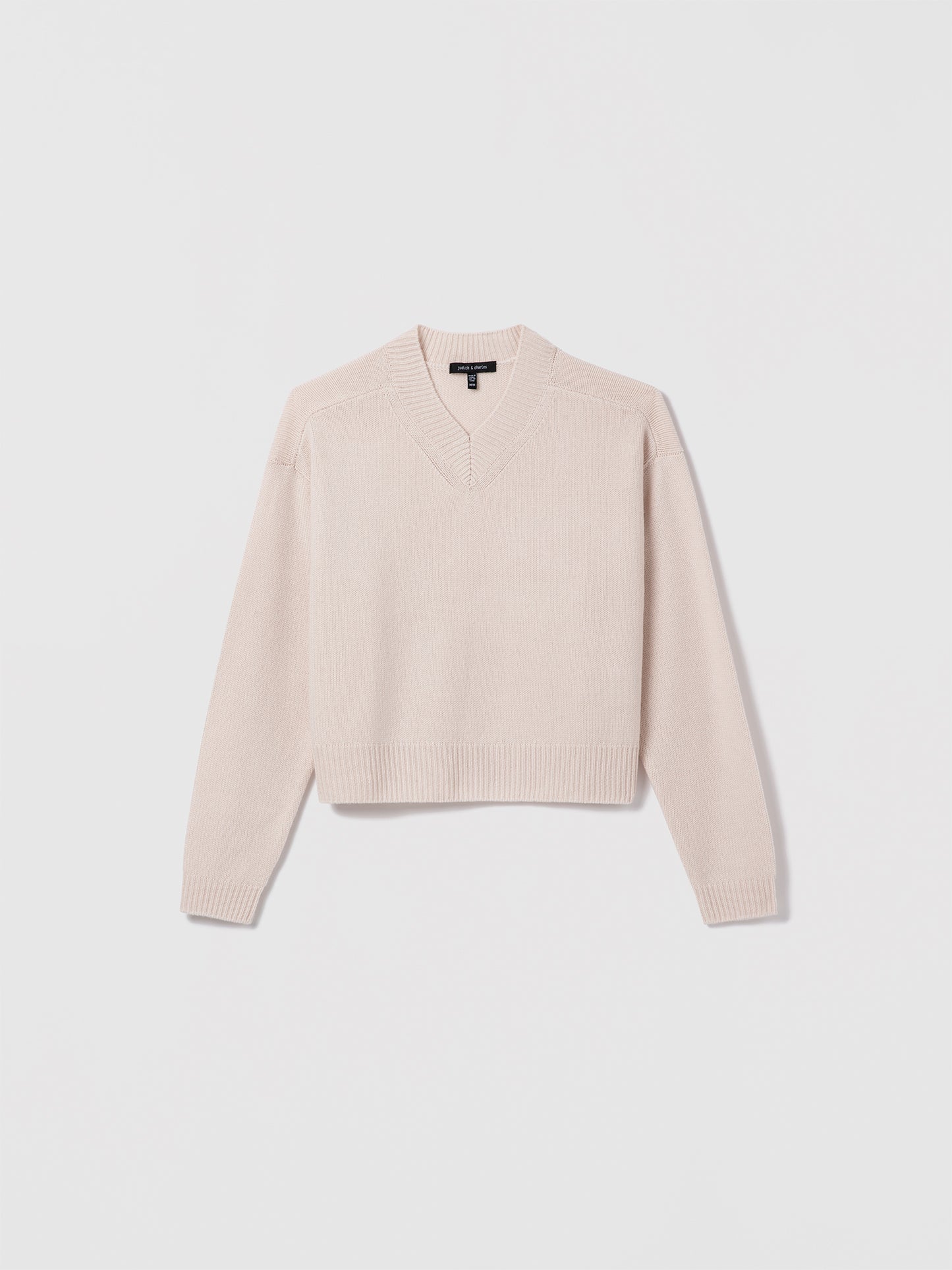 Sand wool-cashmere high V-neck sweater by Judith & Charles.