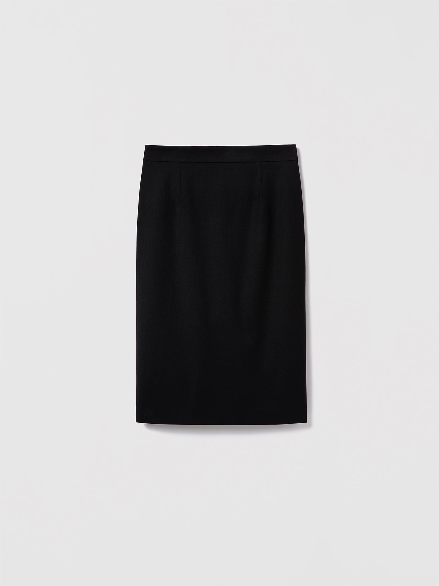 Black fitted pencil skirt by Judith & Charles in stretch suiting fabric, featuring a clean waist, invisible back zipper, back slit, and full lining.