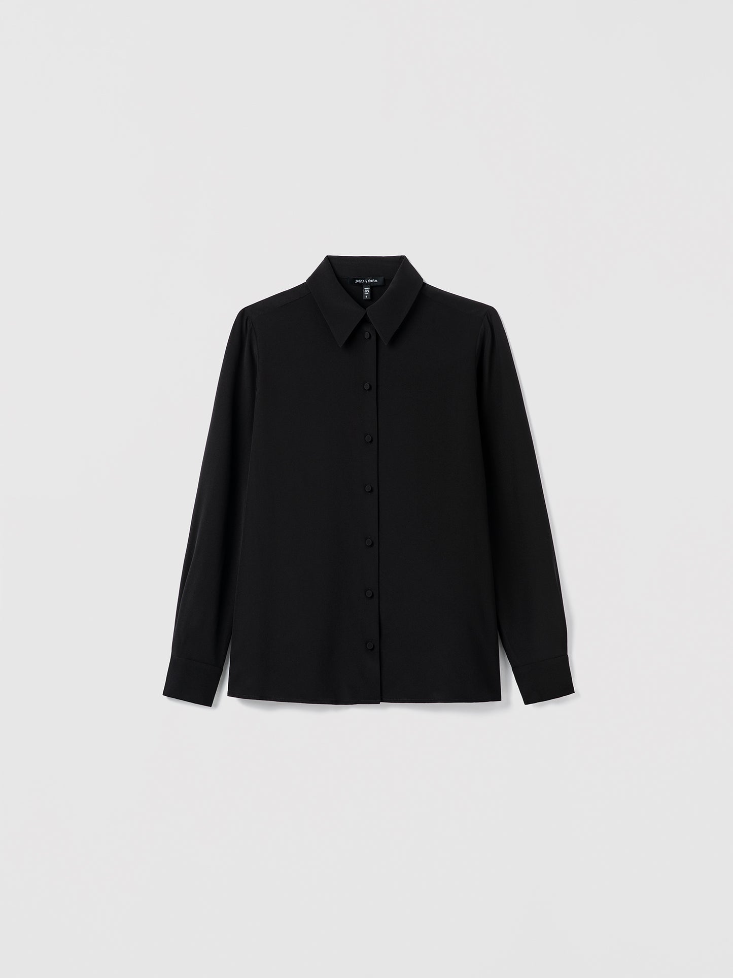 Black shirt on a light gray background