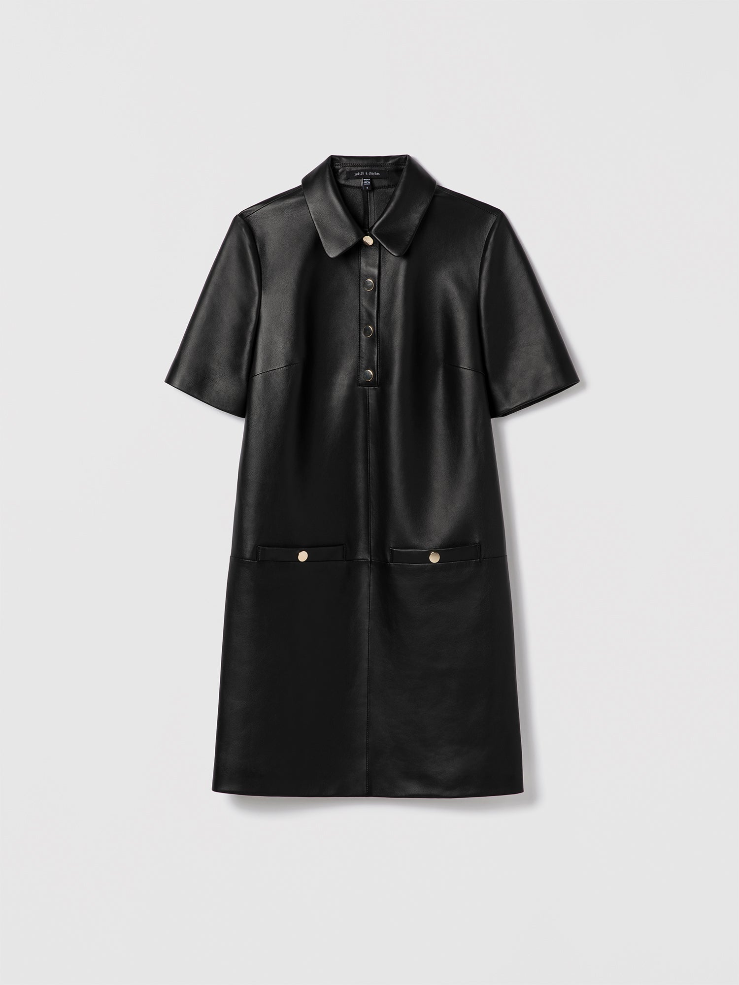 Black leather short sleeve polo dress with spread collar and welt pockets