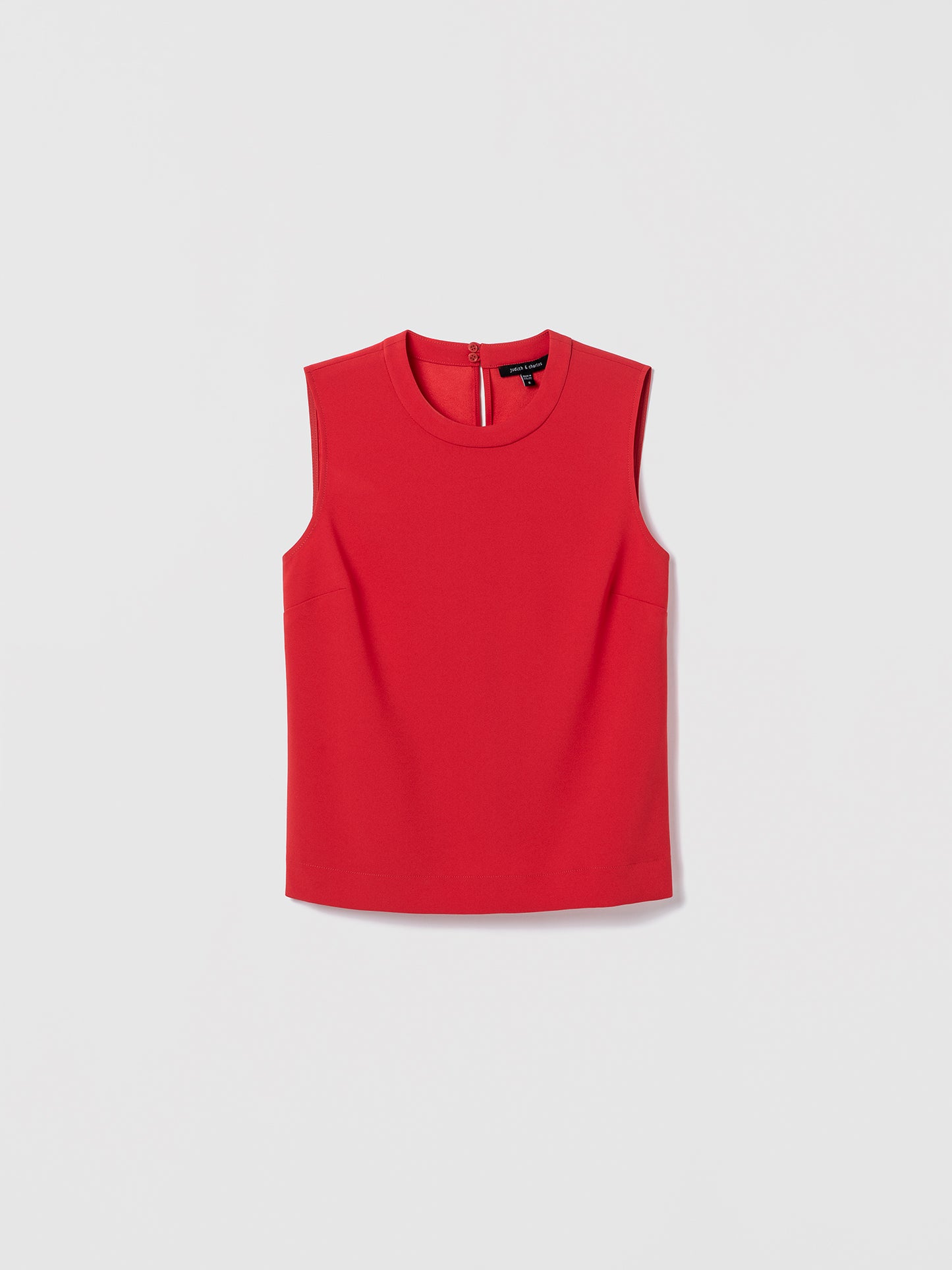 Red sleeveless top on a light gray background