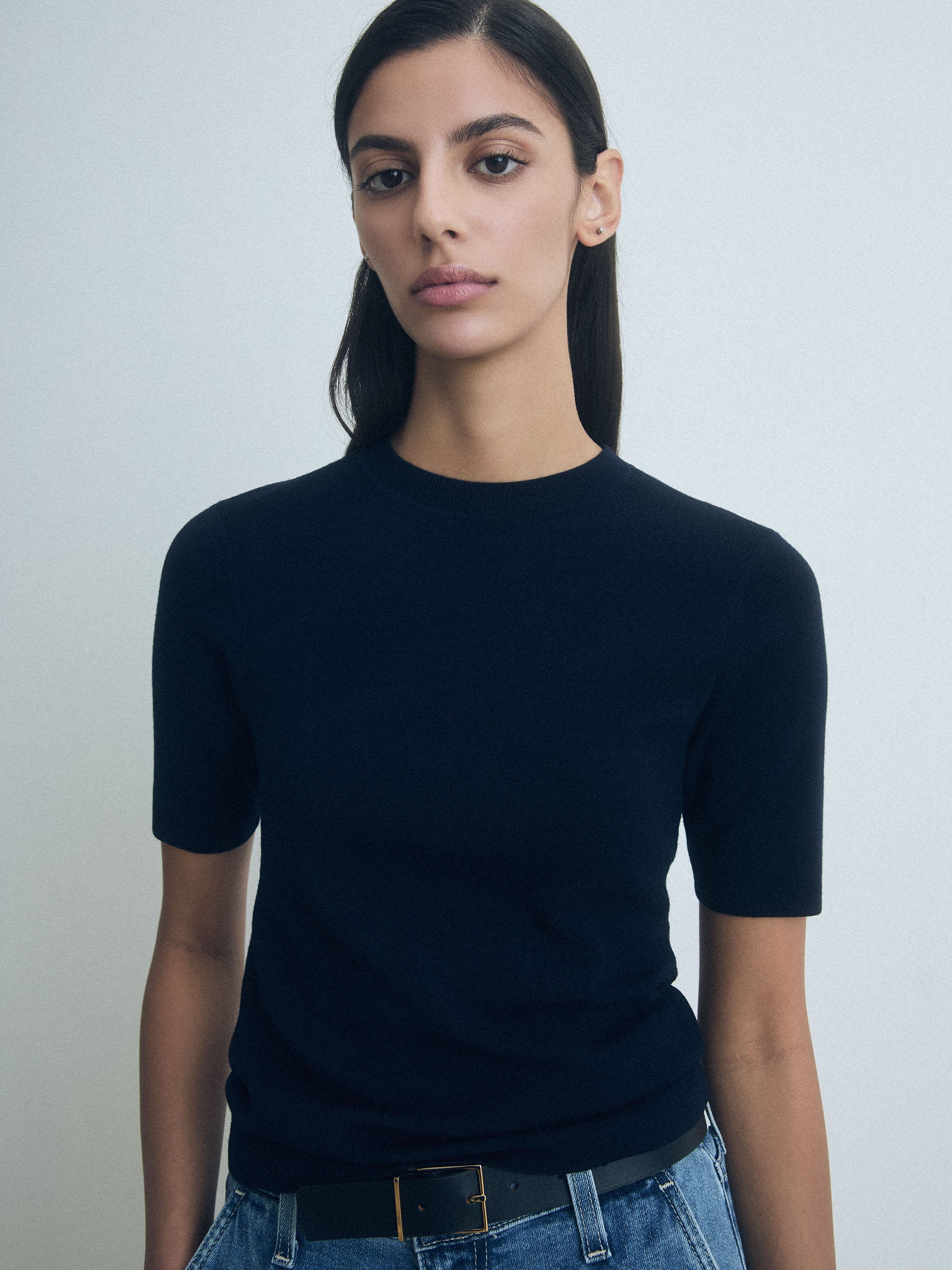 Woman wearing Navy Short Sleeve Sweater with crew neck by Judith & Charles. 