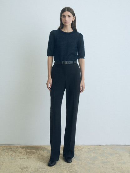 Woman wearing a Deep Ocean cropped mohair pullover with crew neck by Judith & Charles.