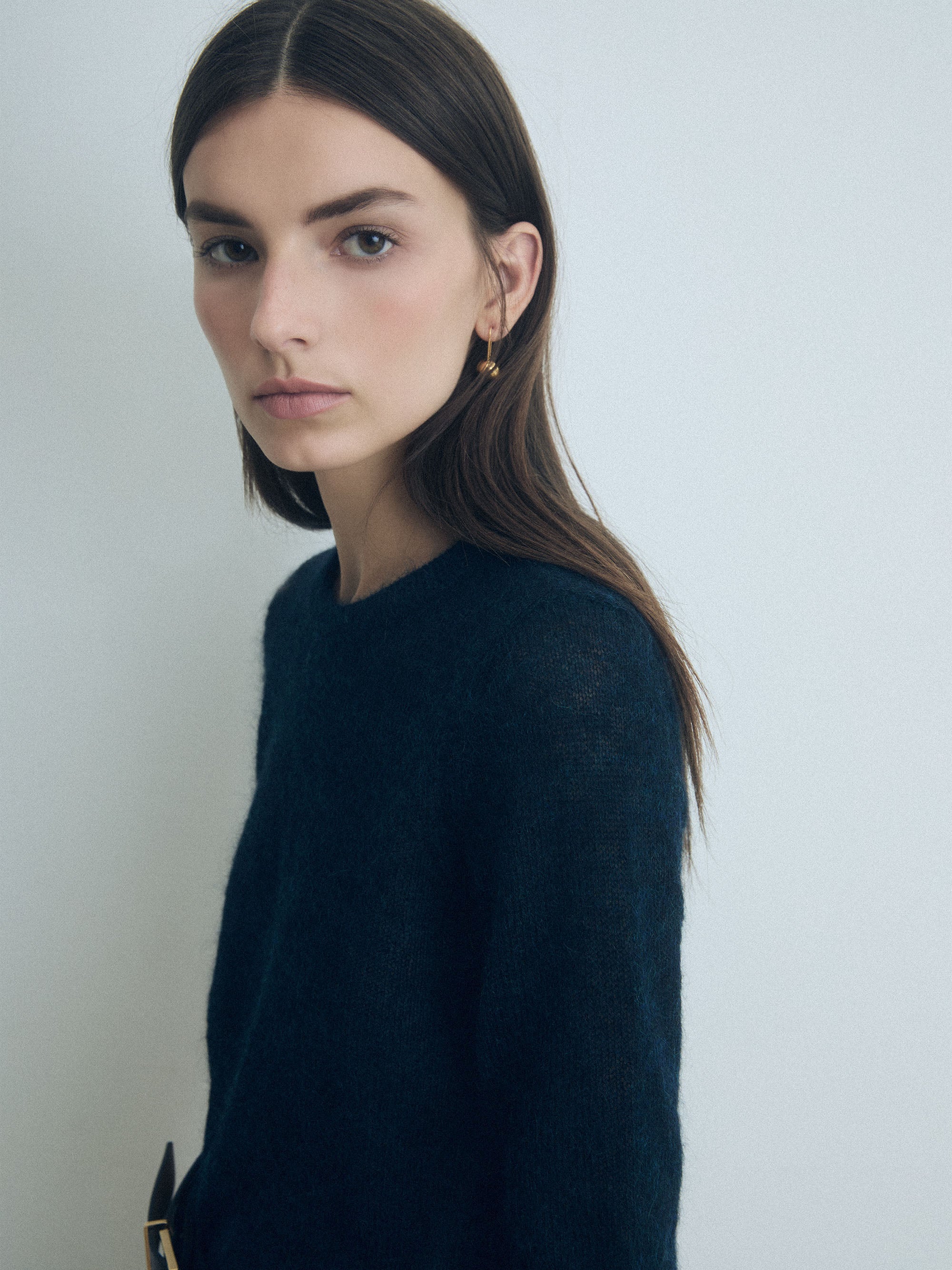 Woman wearing a Deep Ocean cropped mohair pullover with crew neck by Judith & Charles.