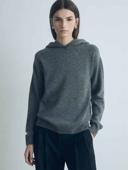 Model wearing Judith & Charles long-sleeve hooded sweater in grey melange Italian merino-cashmere, featuring a relaxed true-to-size fit.