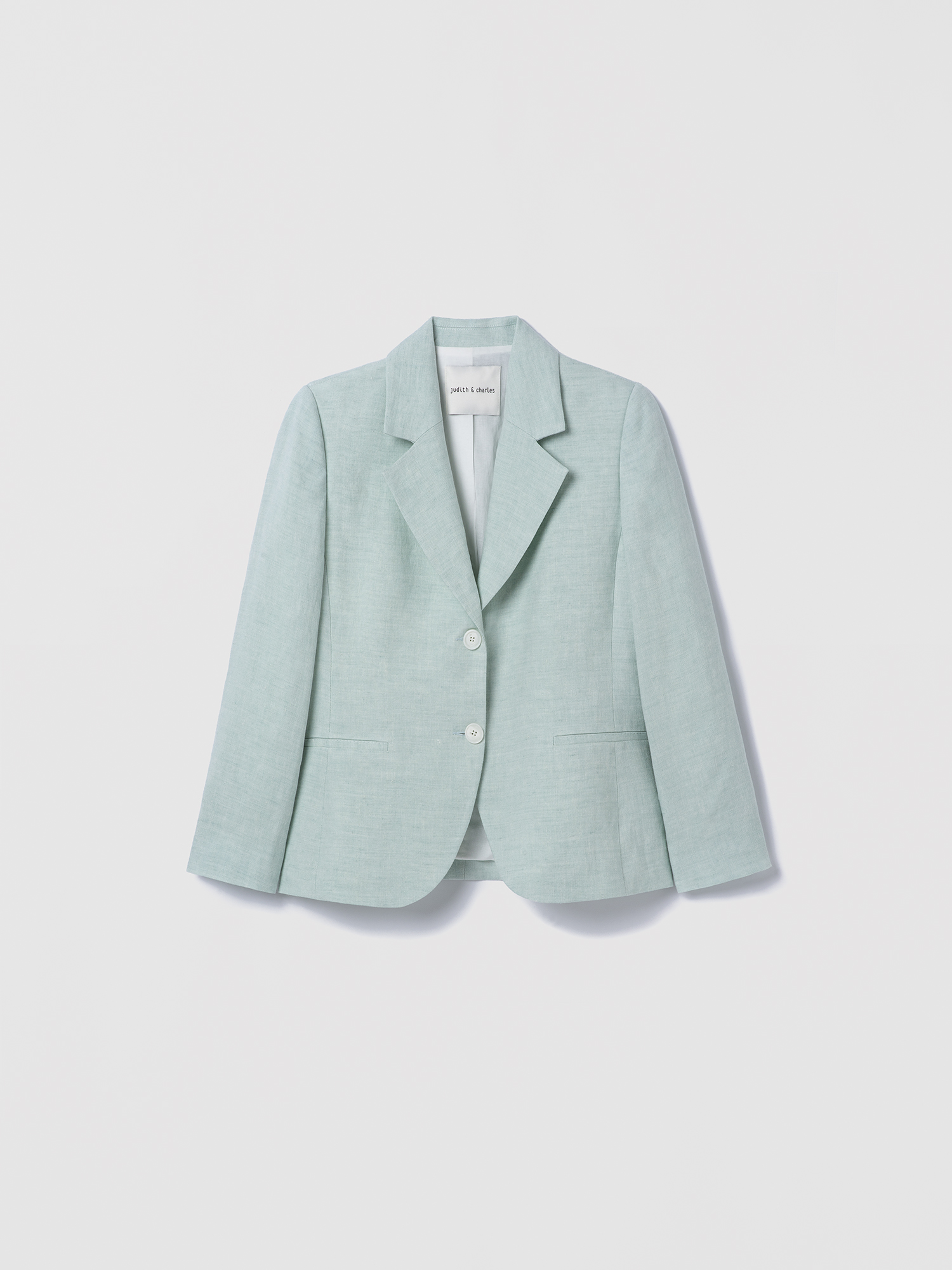 Light green blazer on a light gray background