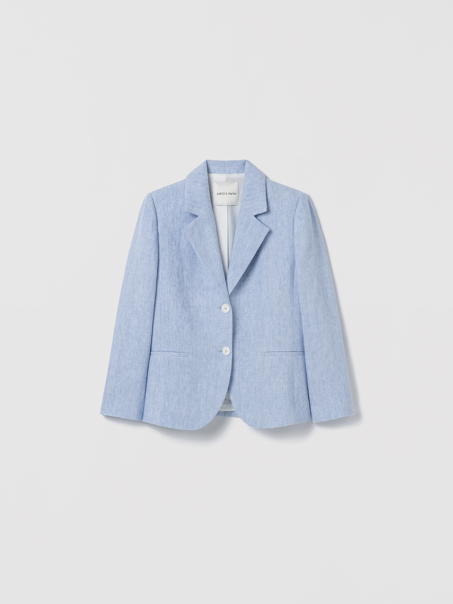 Light blue blazer on a light gray background