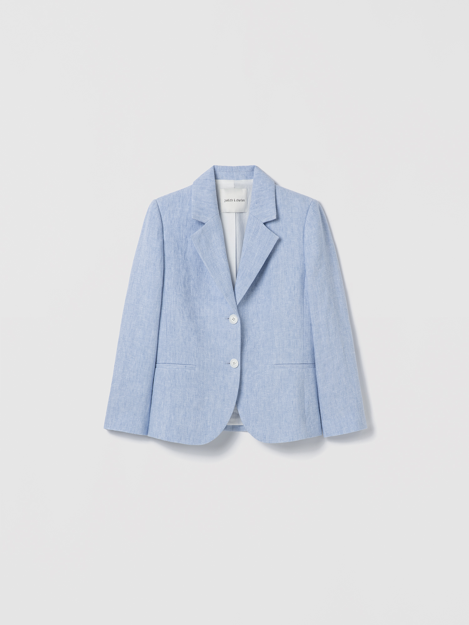 Light blue blazer on a light gray background