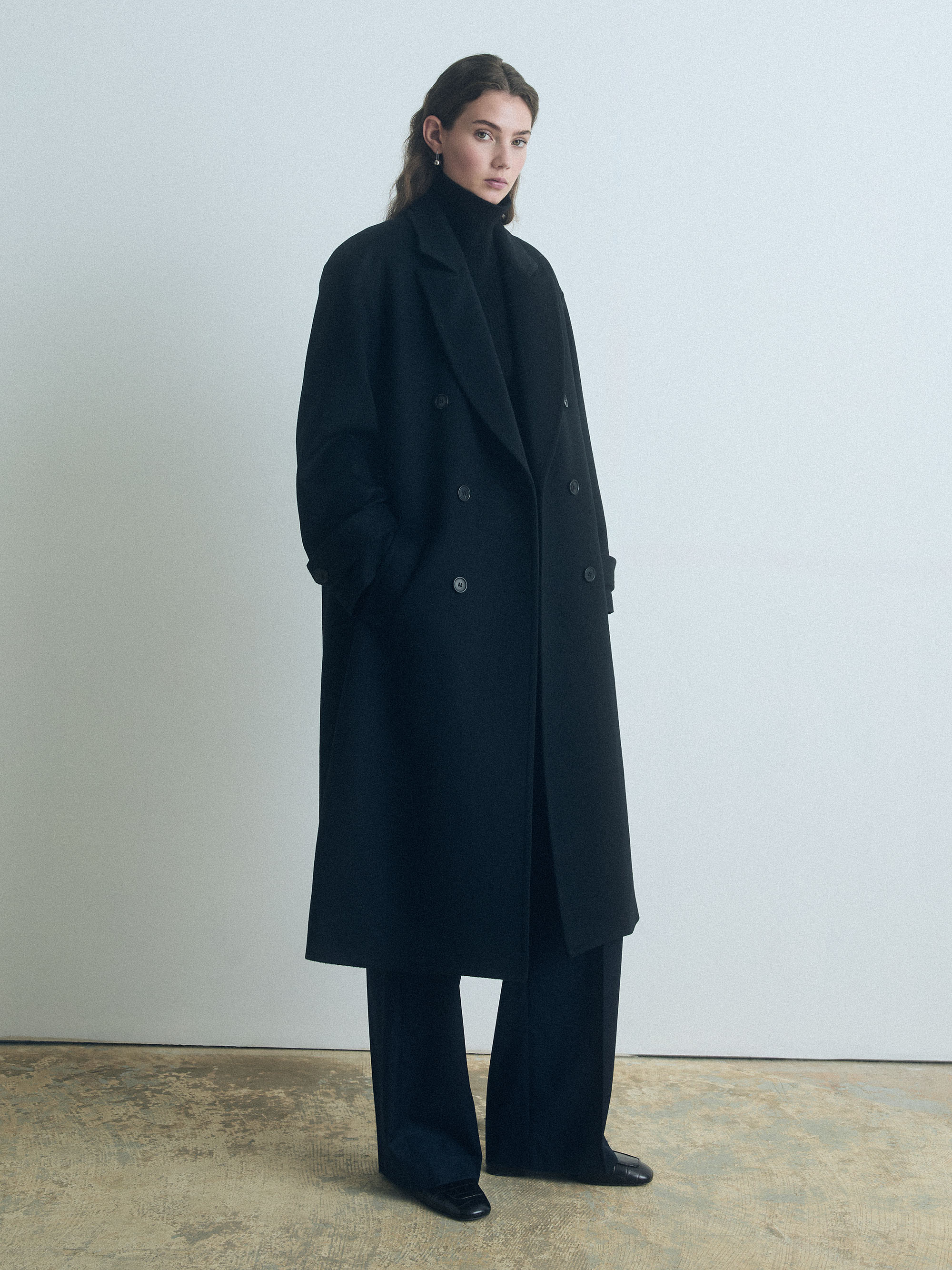 Drop Shoulder double breasted long black coat in wool cashmere by Judith & Charles 