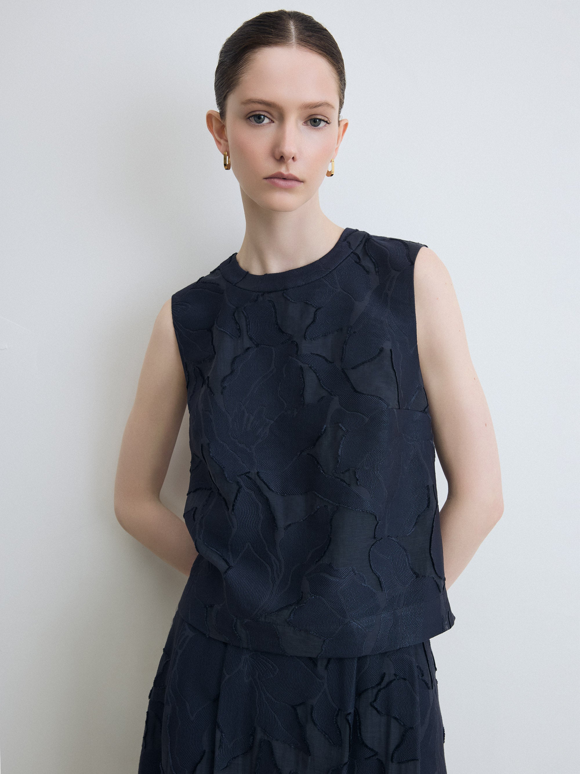 Model wearing navy lace top