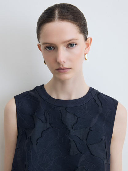 Model wearing navy lace top
