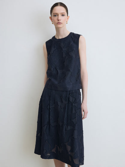 Model wearing navy lace top