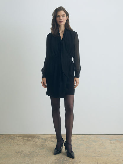 Long-sleeve black wrap dress with V-neckline, gathered front and waist, silk-chiffon sleeves with cuffs, and removable neck tie