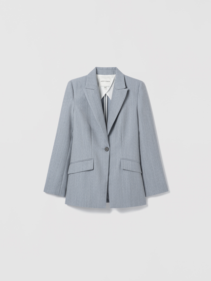 Light blue blazer on a light gray background
