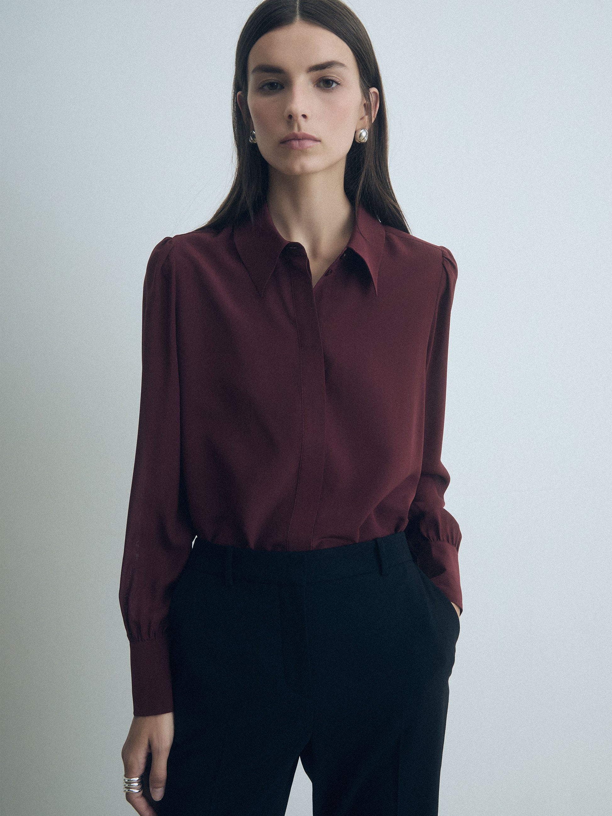 Rust silk blouse from Judith & Charles with a classic collar and concealed button placket.
