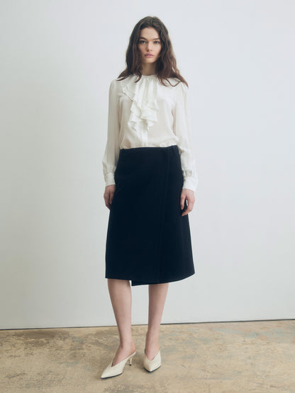 Silk ruffle blouse with stand collar, long sleeves, and double-layer ruffle detail, styled with a black skirt for an elegant look