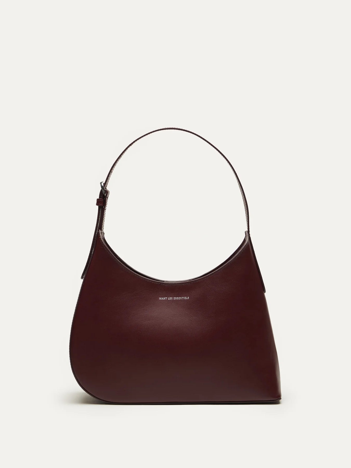 Judith & Charles — Want Les Essentiels dark cherry leather shoulder bag with sculpted silhouette, smooth finish, and minimalist design