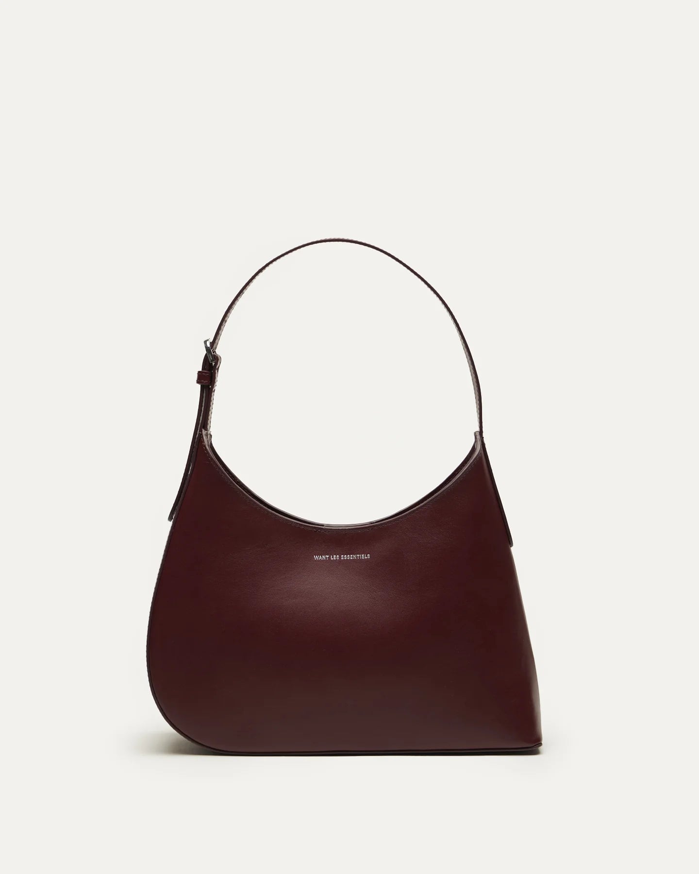 Judith & Charles — Want Les Essentiels dark cherry leather shoulder bag with sculpted silhouette, smooth finish, and minimalist design