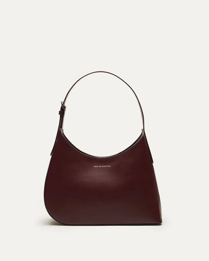 Judith & Charles — Want Les Essentiels dark cherry leather shoulder bag with sculpted silhouette, smooth finish, and minimalist design