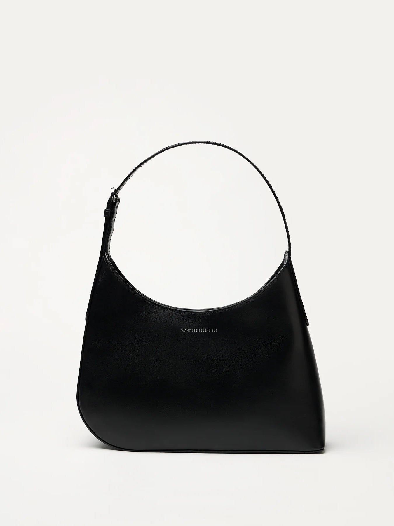 Judith & Charles — Want Les Essentiels black leather shoulder bag with sculpted silhouette, smooth finish, and minimalist design