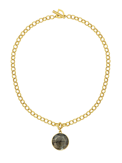 Gold bracelet with a round stone pendant on a white background