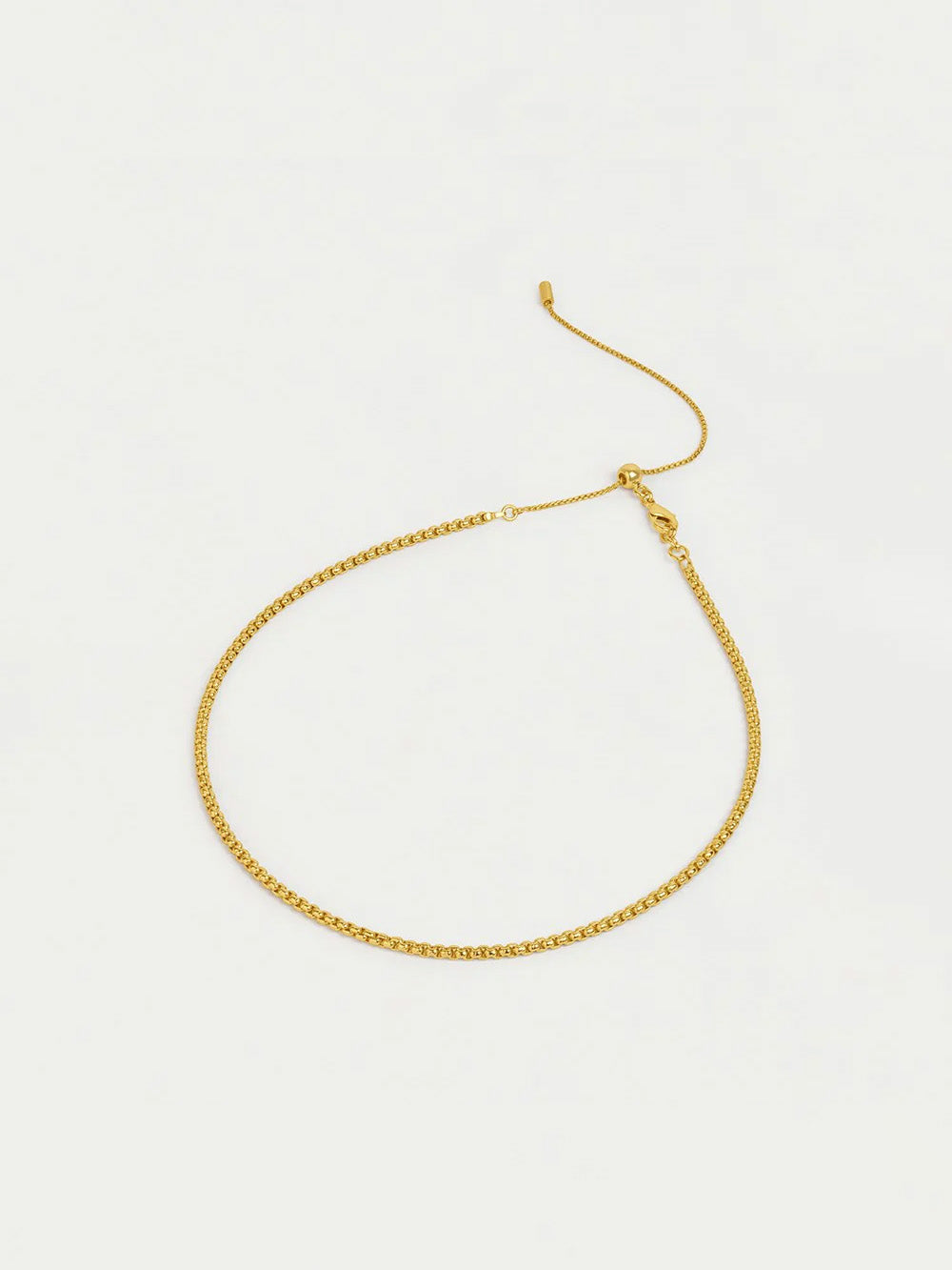 Gold necklace on a white background