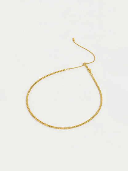 Gold necklace on a white background