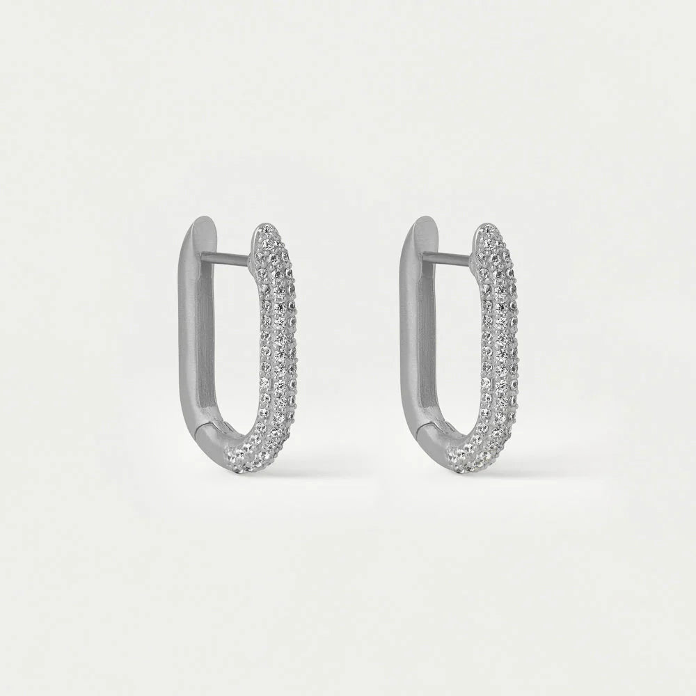 Pair of silver hoop earrings on a light gray background