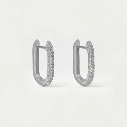 Pair of silver hoop earrings on a light gray background