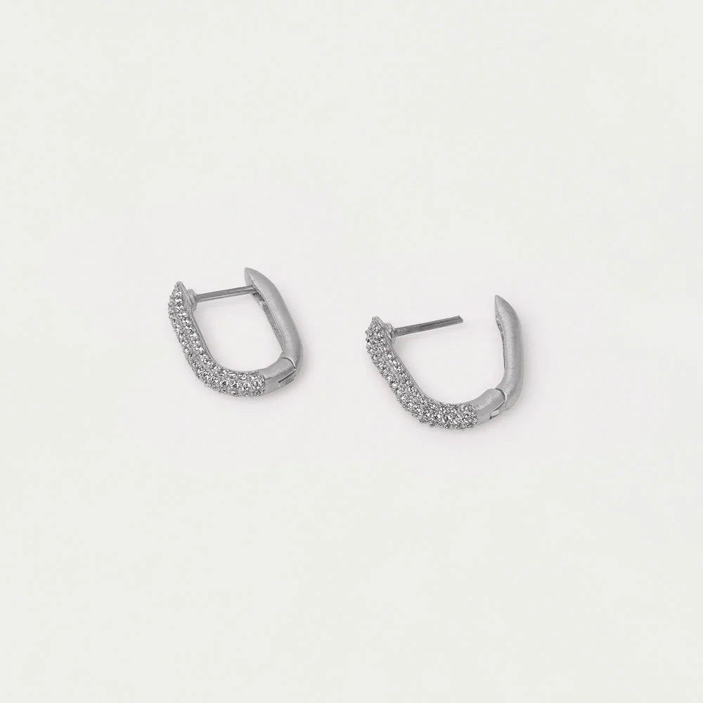 Pair of silver hoop earrings on a light gray background