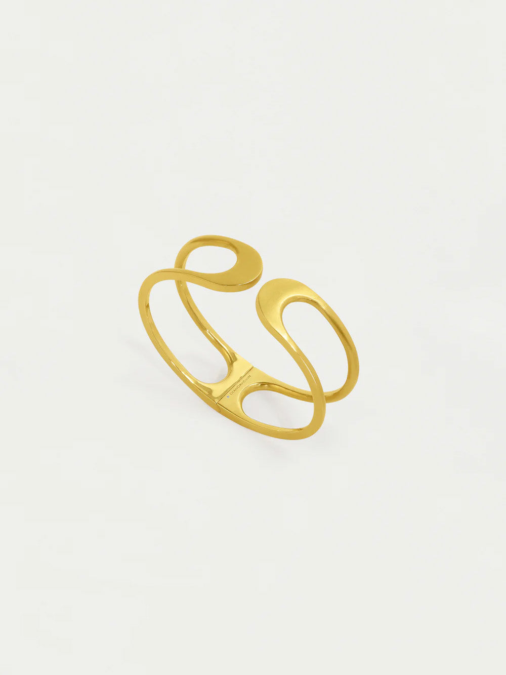 Gold open ring on a light gray background