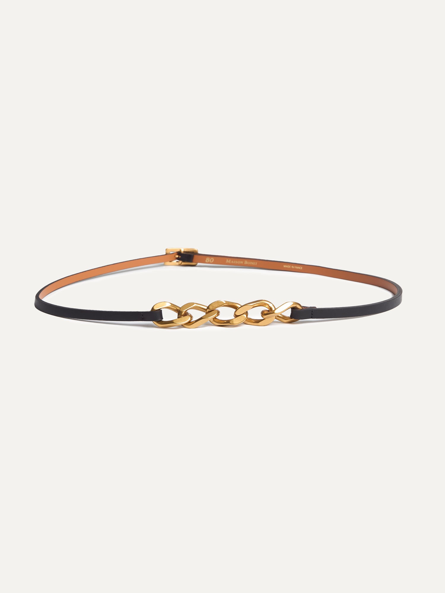 Black and gold Gabrielle Belt by Maison Bonnet crafted in supple nappa cowhide leather with split leather lining, featuring a striking gold-finish zamac buckle and chain.