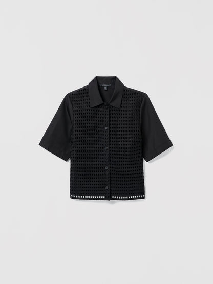 Black textured shirt on a light gray background