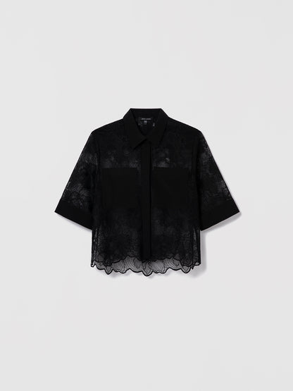Black lace shirt by Judith & Charles featuring a stand collar, front button closure, two patch pockets, and scalloped lace hem; unlined.