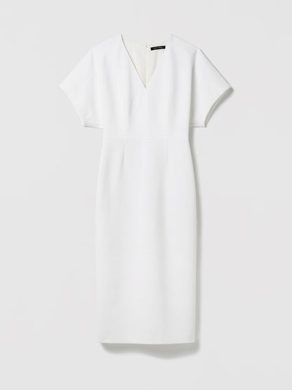 White dress with a V-neckline on a light gray background