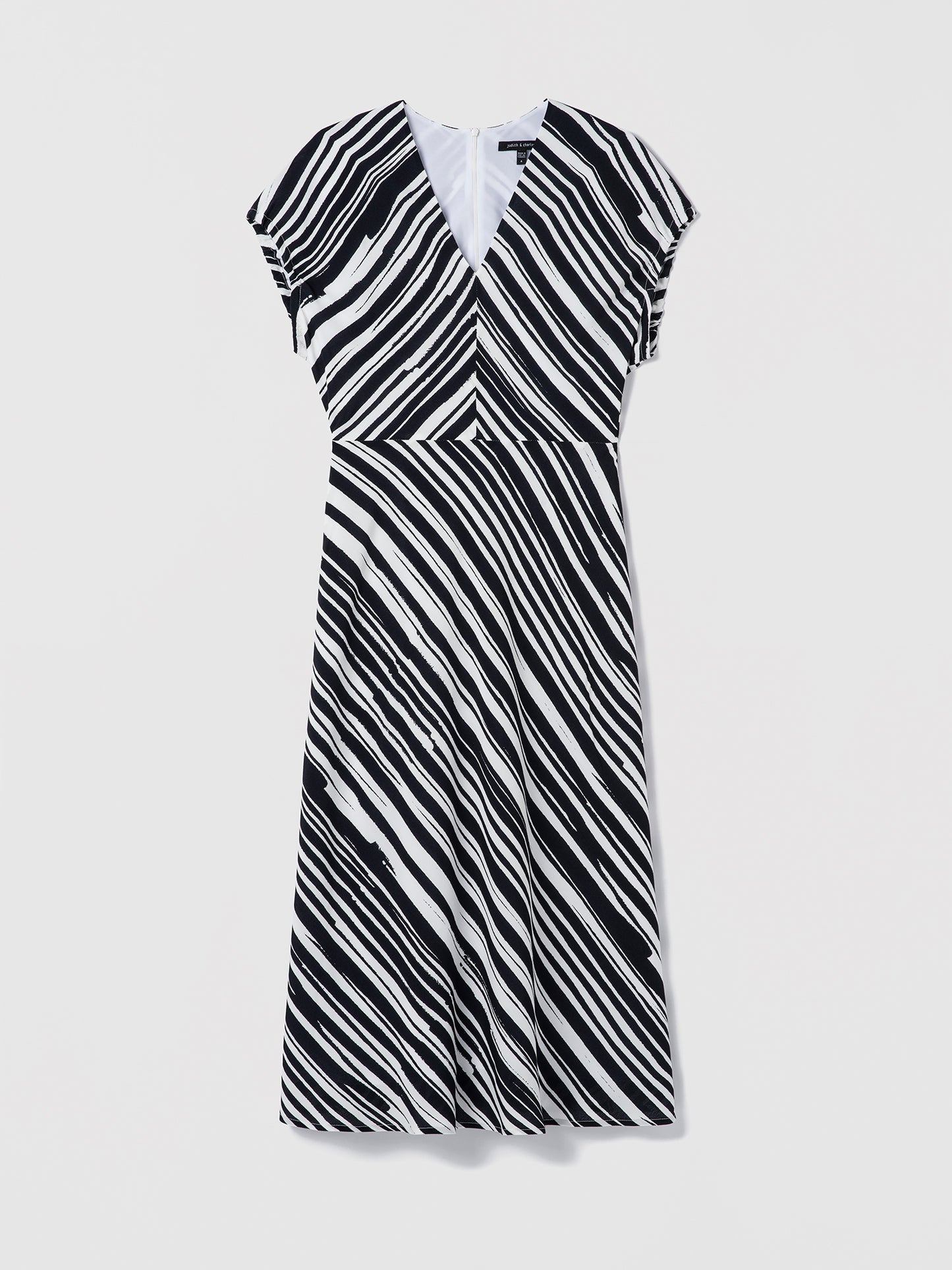 Black and white striped dress on a light gray background