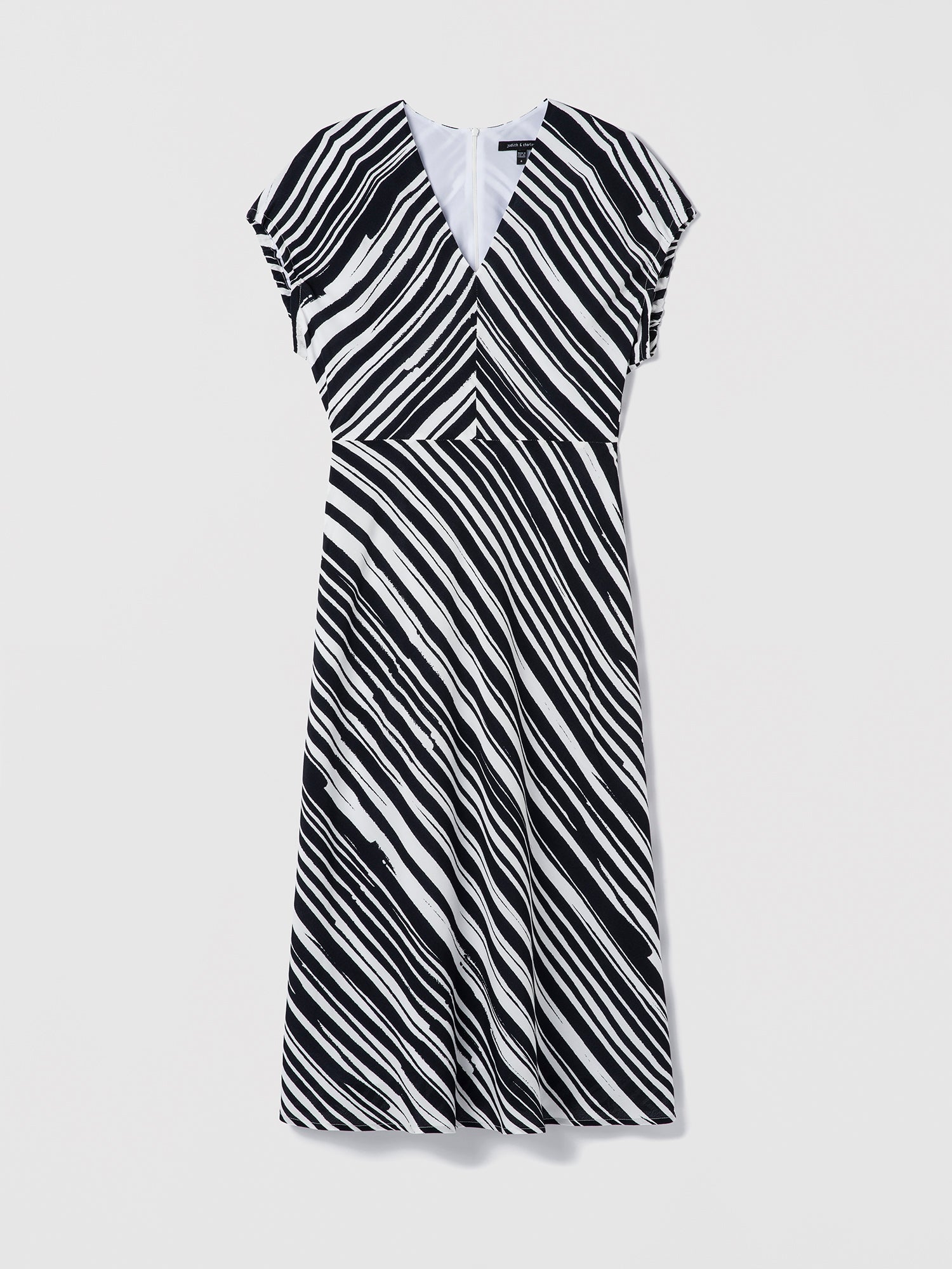Black and white striped dress on a light gray background
