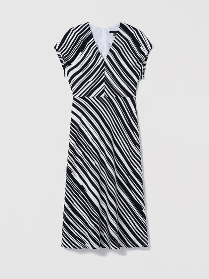 Black and white striped dress on a light gray background