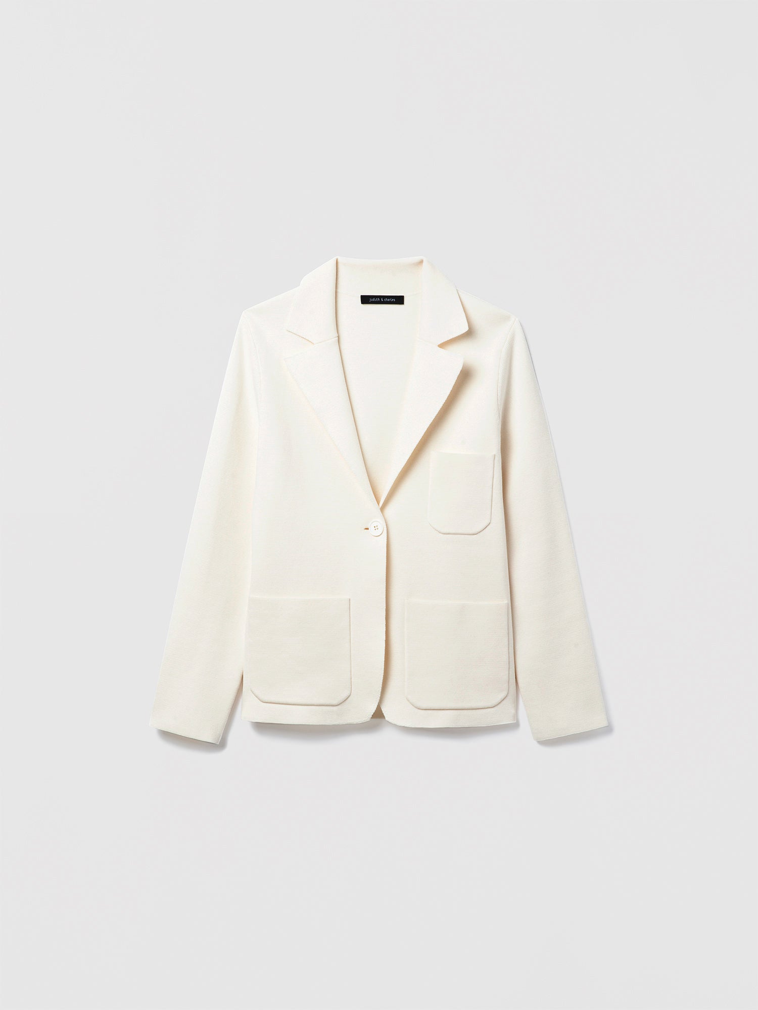 Judith and Charles Off-White Atticus Jacket – Semi-fitted, one-button knit jacket in 100% mercerized cotton with notch lapel, patch pockets, chest pocket, and 24.5″ back length; made from Italian fabric.