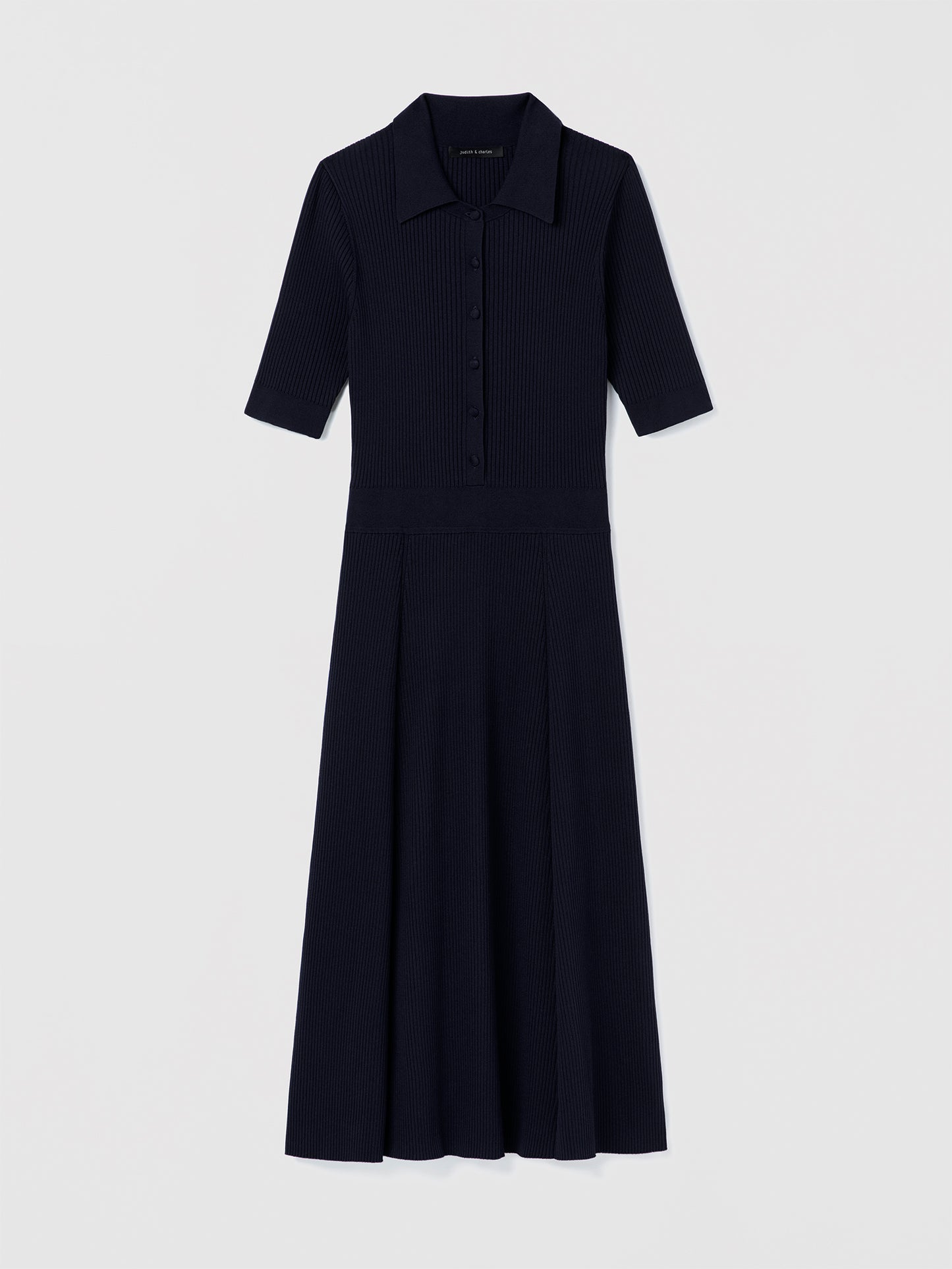 Judith and Charles Navy Bates Dress – short-sleeve ribbed polo dress with spread collar, self-covered button-front, and A-line silhouette; 45″ back length 