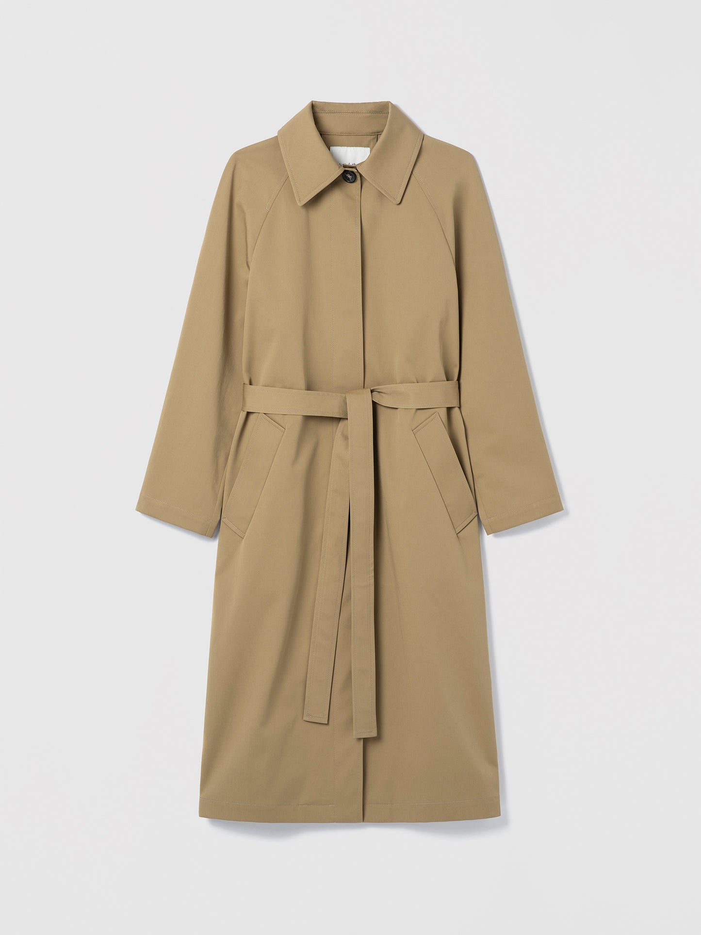 Long cotton trench coat with belt and welt pockets, shown in a clean, structured silhouette.