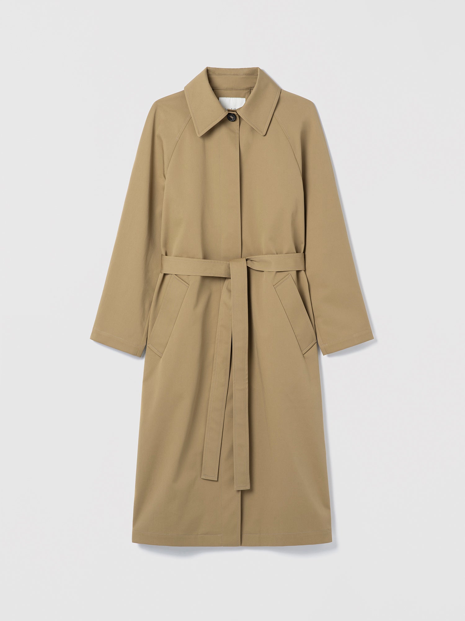 Long cotton trench coat with belt and welt pockets, shown in a clean, structured silhouette.