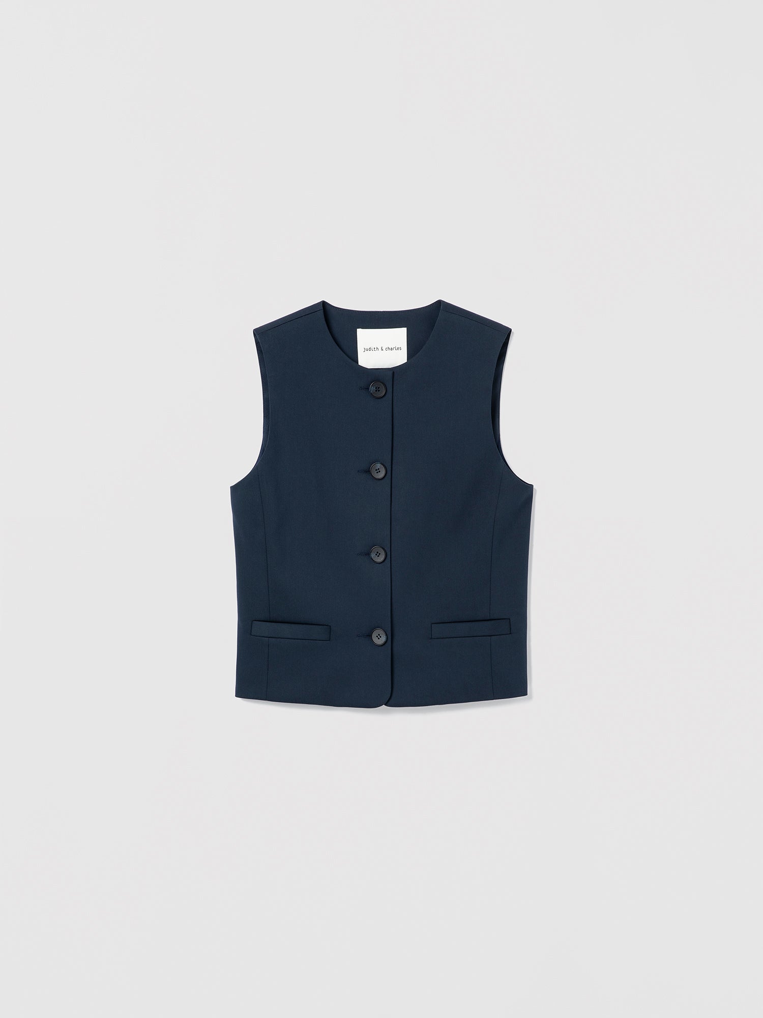 Navy blue vest with buttons on a light gray background