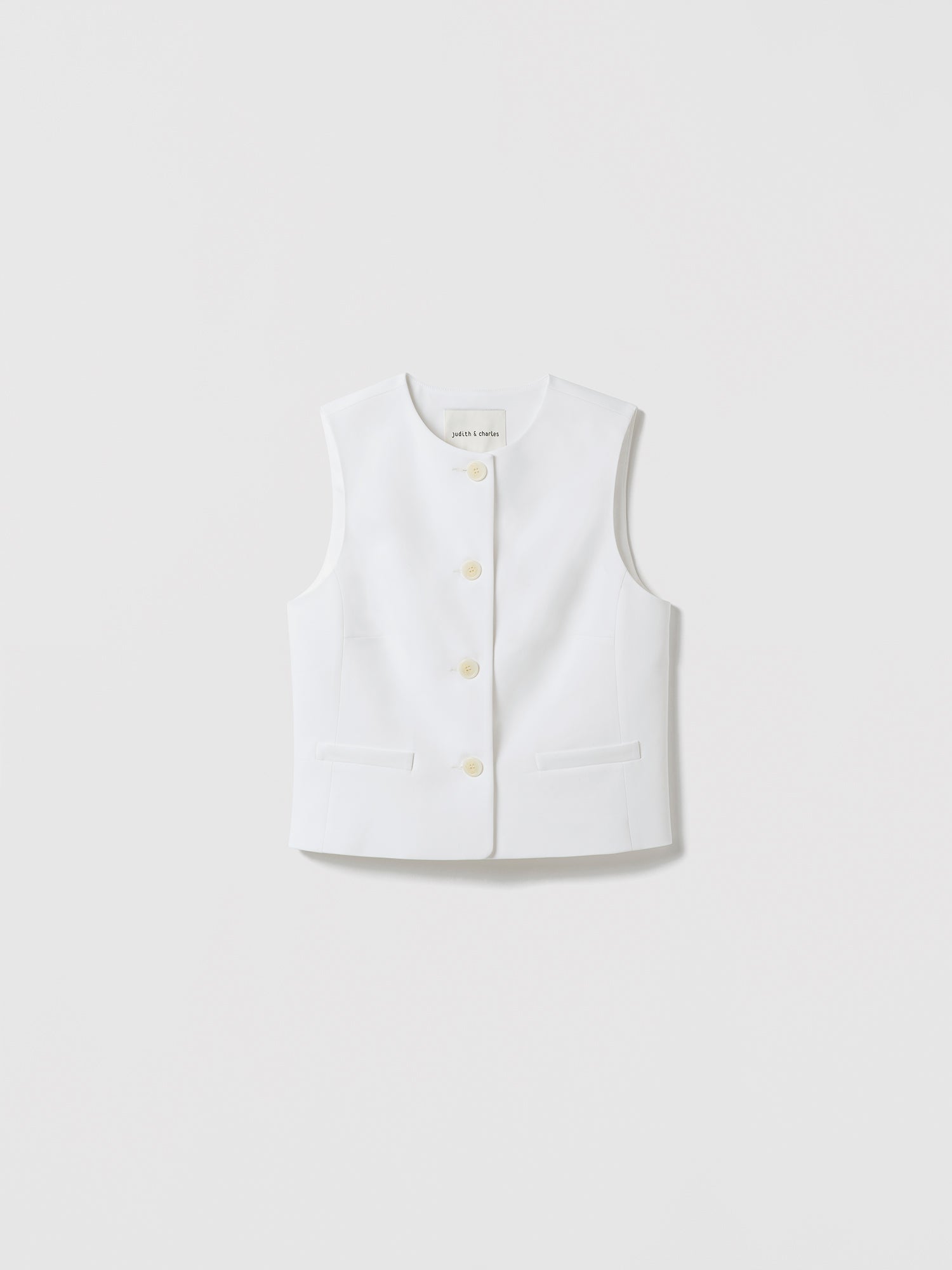 White vest with buttons on a light gray background