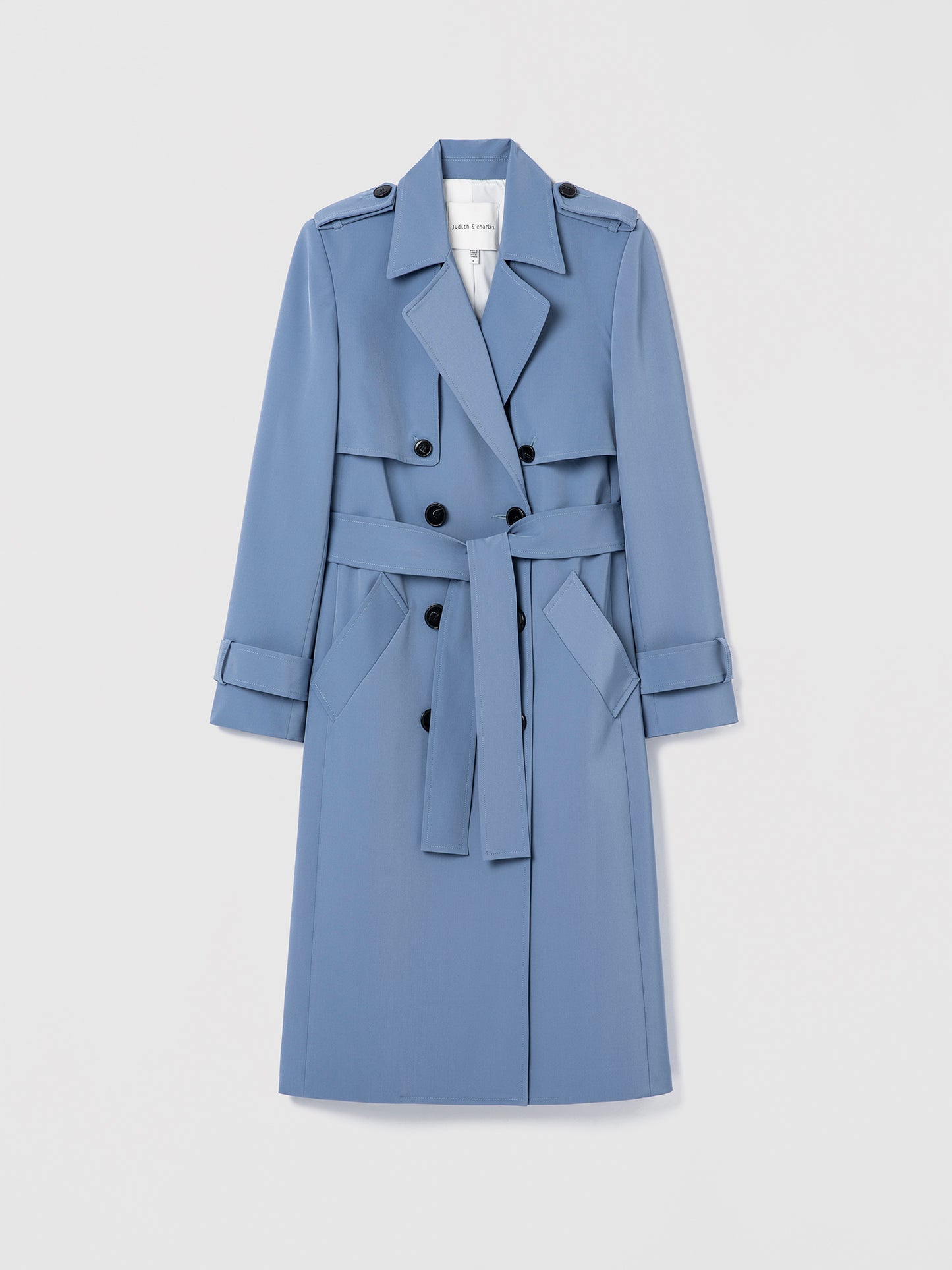 Blue trench coat on a light gray background