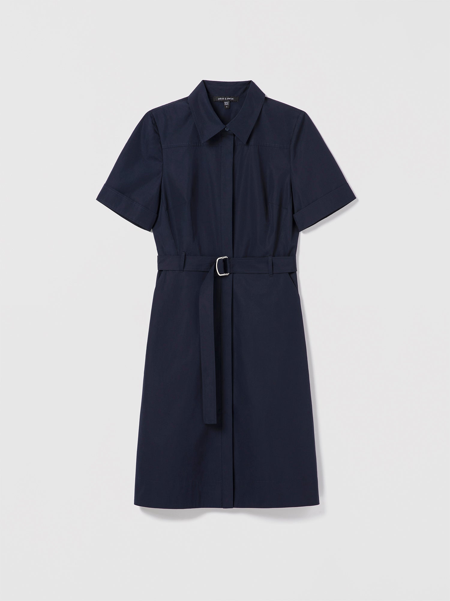 Judith & Charles navy poplin shirt dress with short sleeves, front buttons, slash pockets, and self-belt
