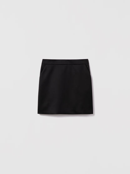 Black Diara skirt by Judith and Charles, short straight style in textured stretch linen with slash pockets. Made in Canada with Italian fabric