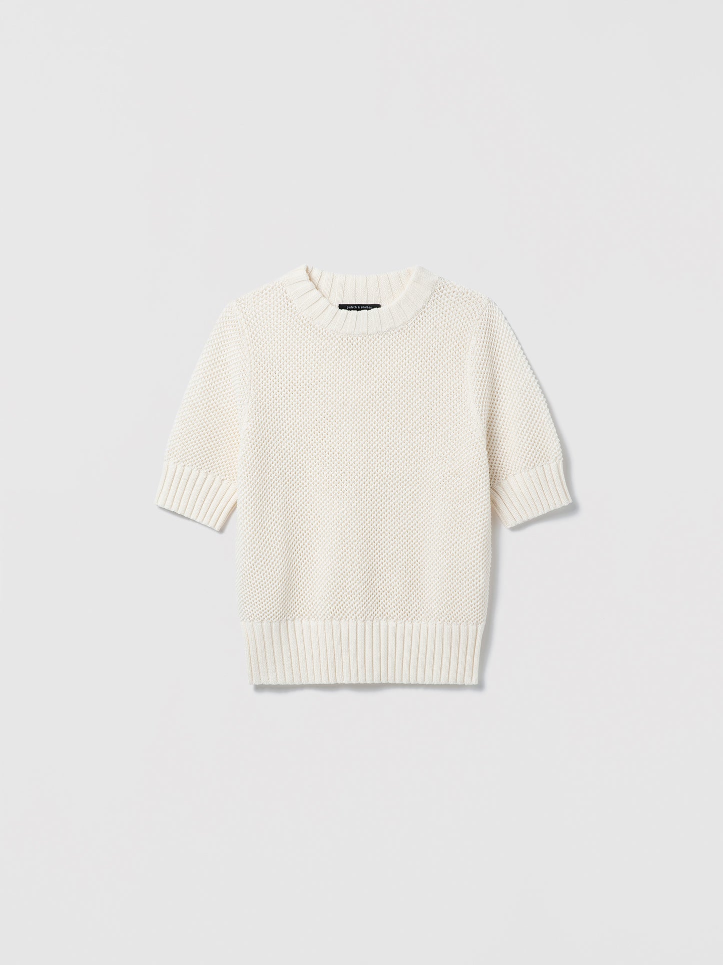 White sweater on a light gray background